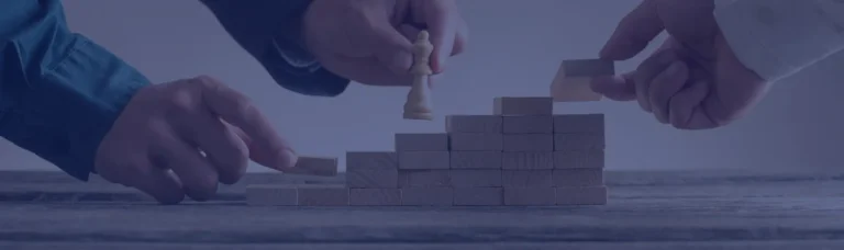 Northeastern University x Covenant Technology - stacked wooden blocks making stairs with a chess piece in hand